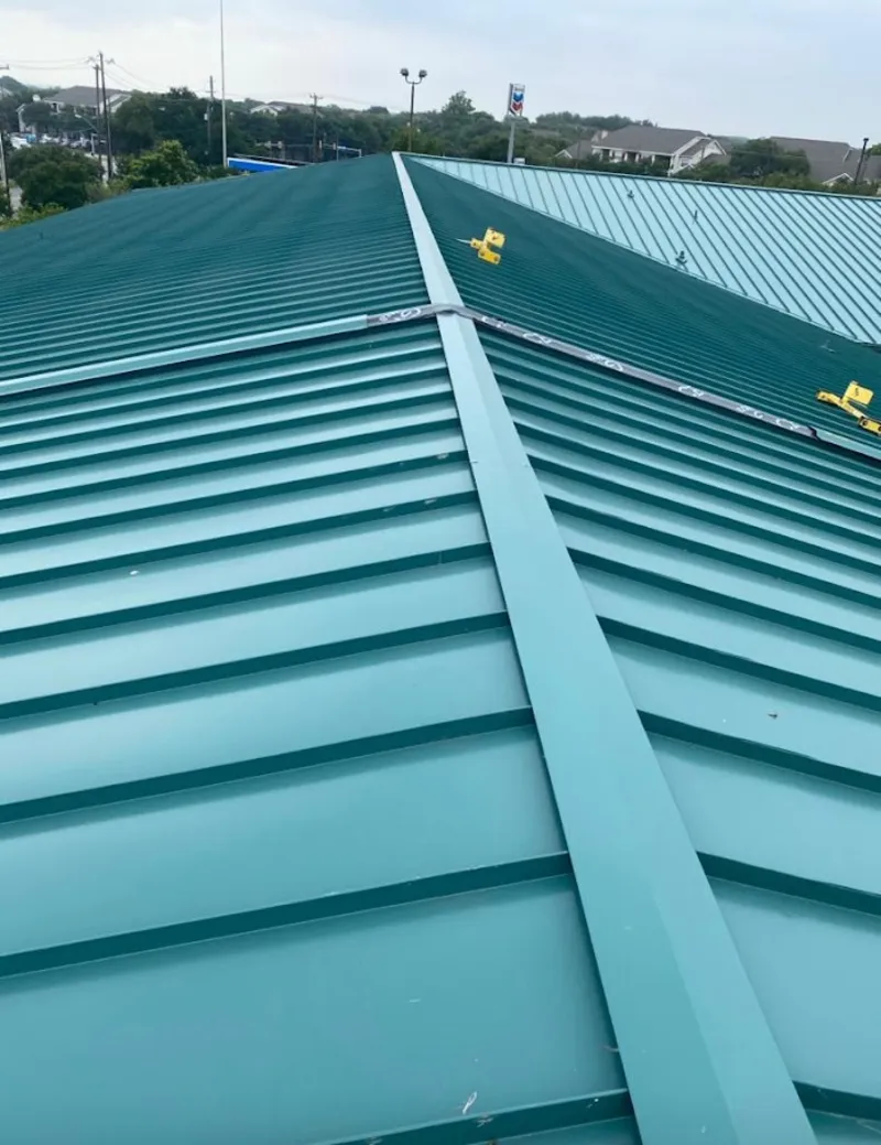 Green commercial metal roof ridge and valley for Metal Roof Repair in Hyde Park